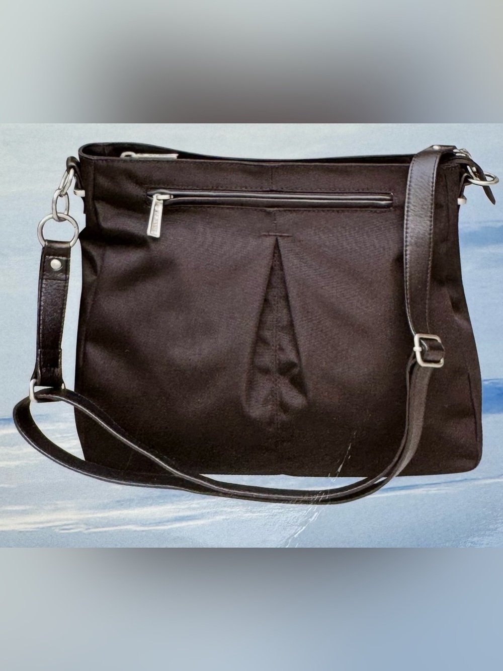 TravelPro women’s handbag in black. Adjustable strap. 
Style#TP108101401. NWT
